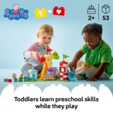 Two Young Children Play with Colorful Building Blocks and a Toy Tower on a Light Blue Background Smiling As They Build Together While Learning
