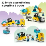 Lego Construction Scene with Several Yellow Trucks Blue Cranes Workers and Scattered Bricks Illustrating the Idea of 22 Bricks Forming 6 Trucks