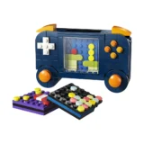 Blue Lego Brick Toy Resembling a Retro Cameraboombox with Orange Accents and a Clear Central Window Showing Colorful Studs