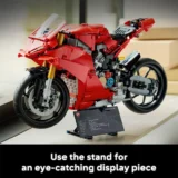 Red Lego Ducati Motorcycle Model on a Display Stand with an Information Plaque Nearby