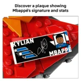 Lego style Plaque Featuring Kylian Mbappé's Signature and a Cartoon Portrait on a Bed of Red Lego Bricks Highlighting the Autograph