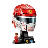 Lego Ferrari Formula 1 Helmet Bust on a Display Stand with a Small Lego Driver Figure in a Red Racing Suit Beside It White Background