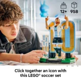Young Person Builds a Large Lego Soccer Statue on a Table with a Blue yellow Arch in the Background Showing an Athlete Figure