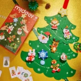 Christmas Craft Kit on a Gold Surface with a Green Felt Christmas Tree and Festive Felt Ornaments Including Santa Snowman Reindeer and Angel Box Labeled 'mideer' Nearby