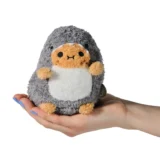 Small Fluffy Gray Hedgehog Plush with Tan Face and White Belly Resting in an Open Hand