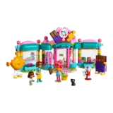 Colorful Lego Friends Candy Shop with Teal Arches Pink Accents and Smiling Minifigures Outside Helping Customers