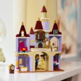 Colorful Lego Castle with Pastel Purple Walls and Tall Burgundy Towers Two Figures Meeting at a Doorway on the Ground Level