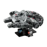 Lego Star Wars Millennium Falcon Model on a Black Display Stand with a Small Commemorative Plaque and Stickers Nearby